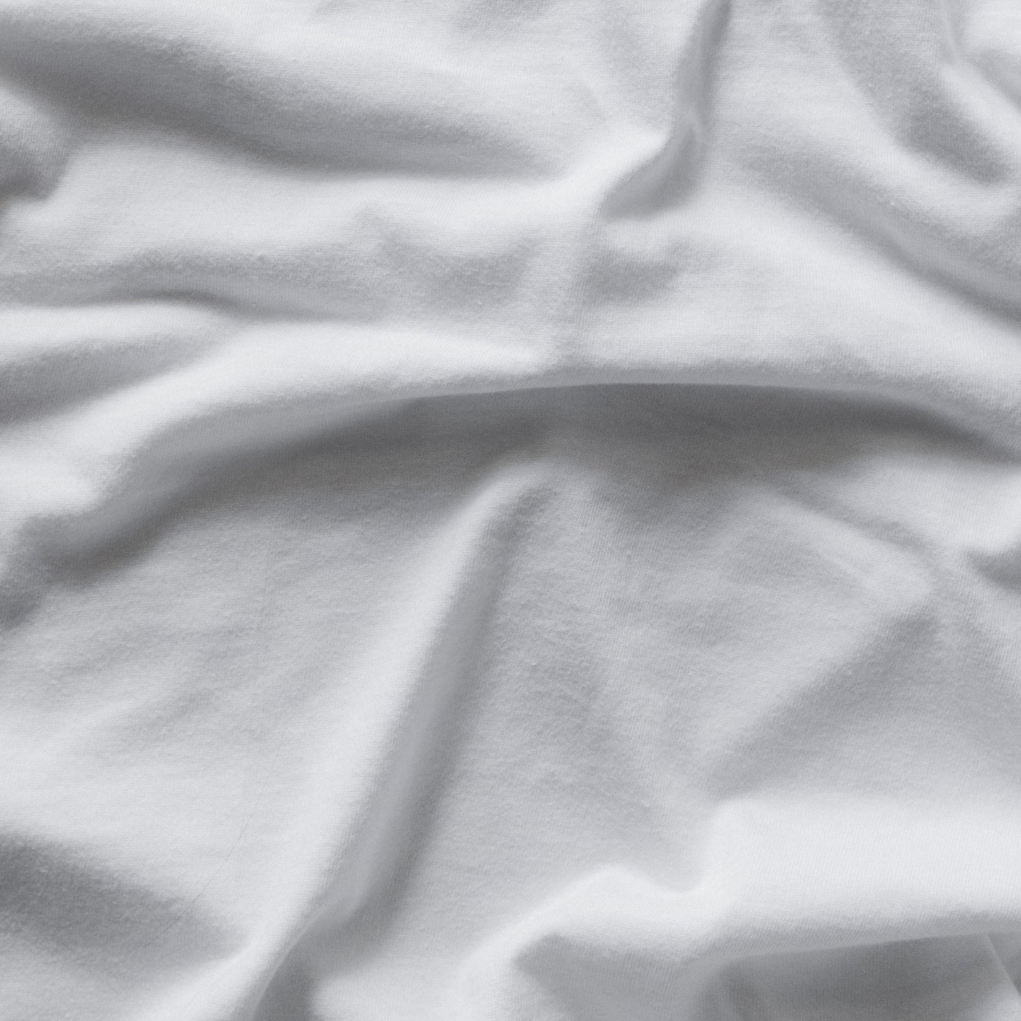 Close-up of white fabric with folds
