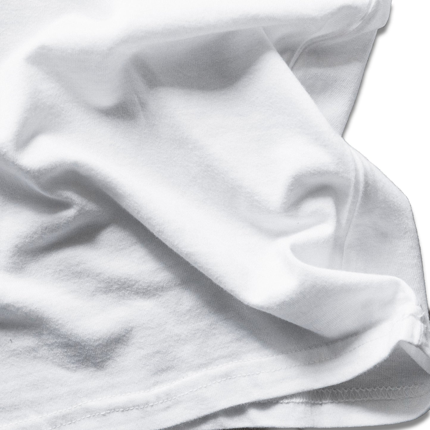 Close-up of white fabric with folds on a white background