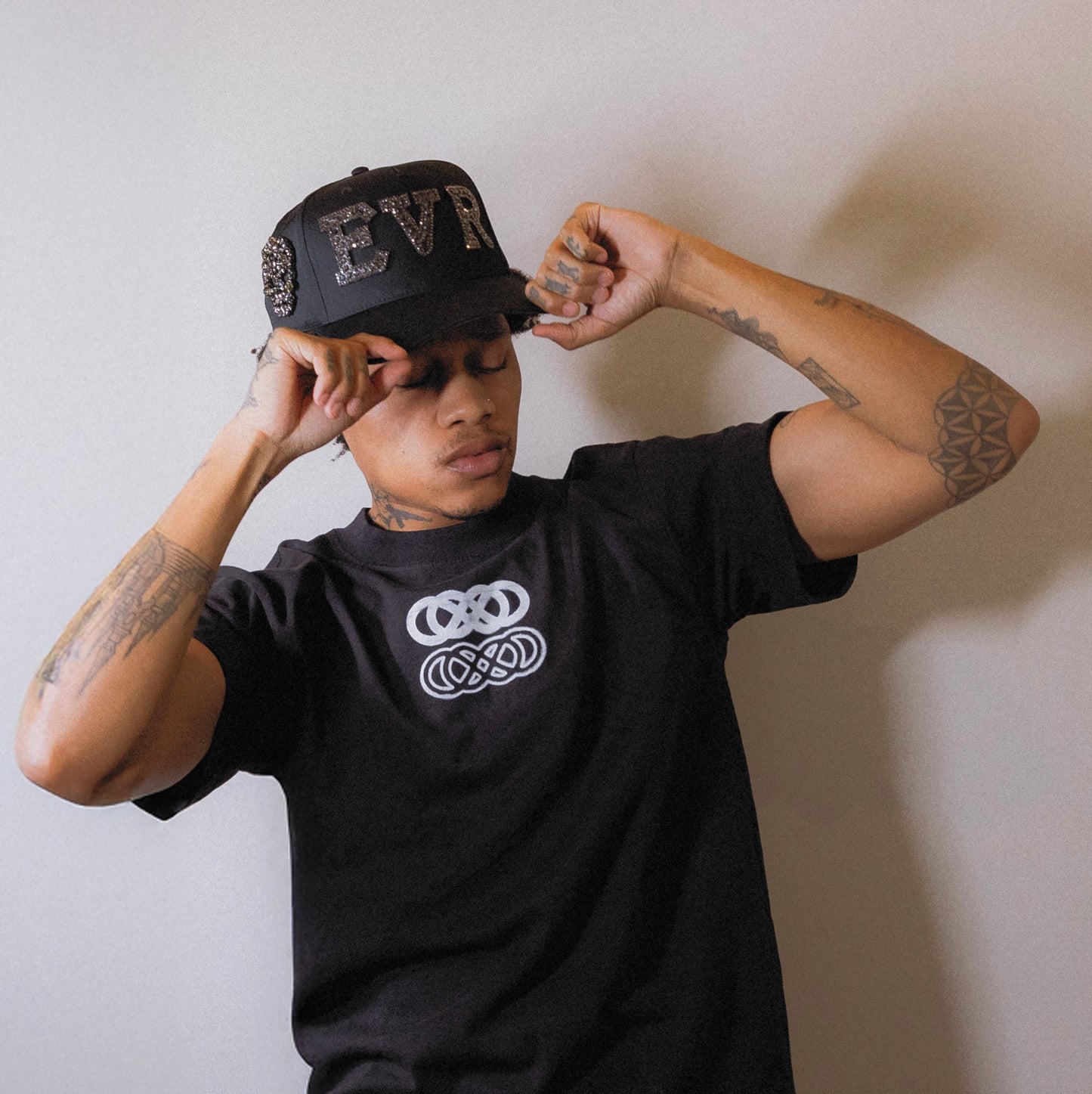 male model wearing rhinestone and pearl hand made baseball cap