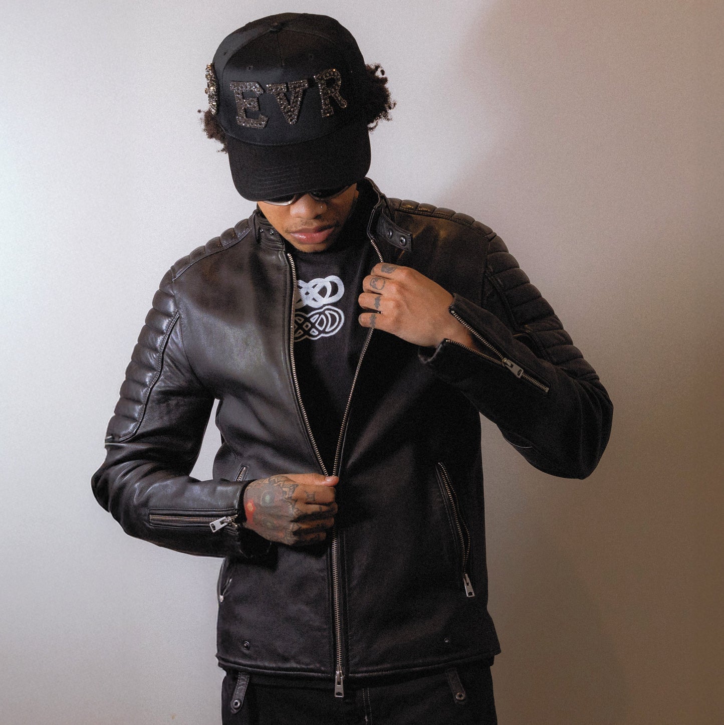 male model wearing rhinestone and pearl hand made baseball cap