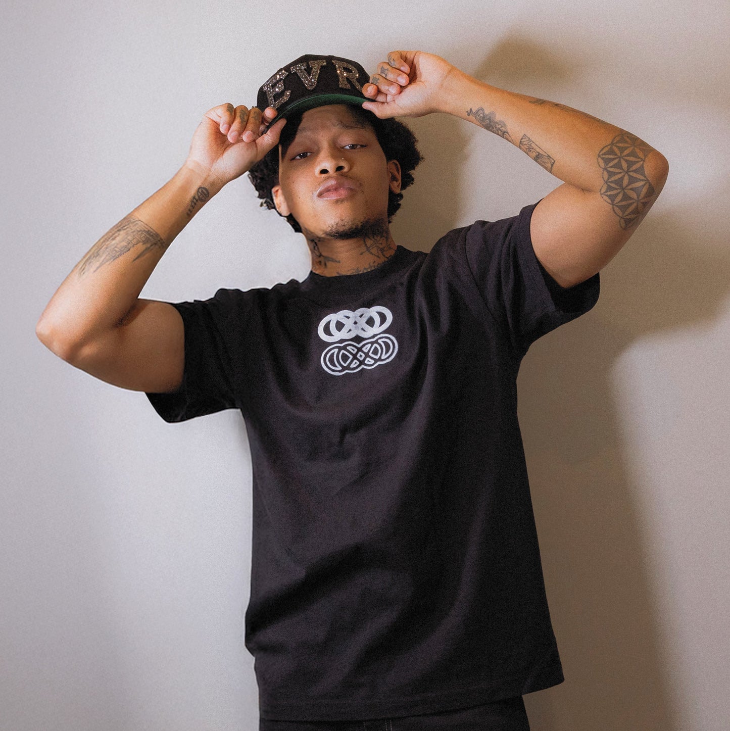 male model wearing rhinestone and pearl hand made baseball cap