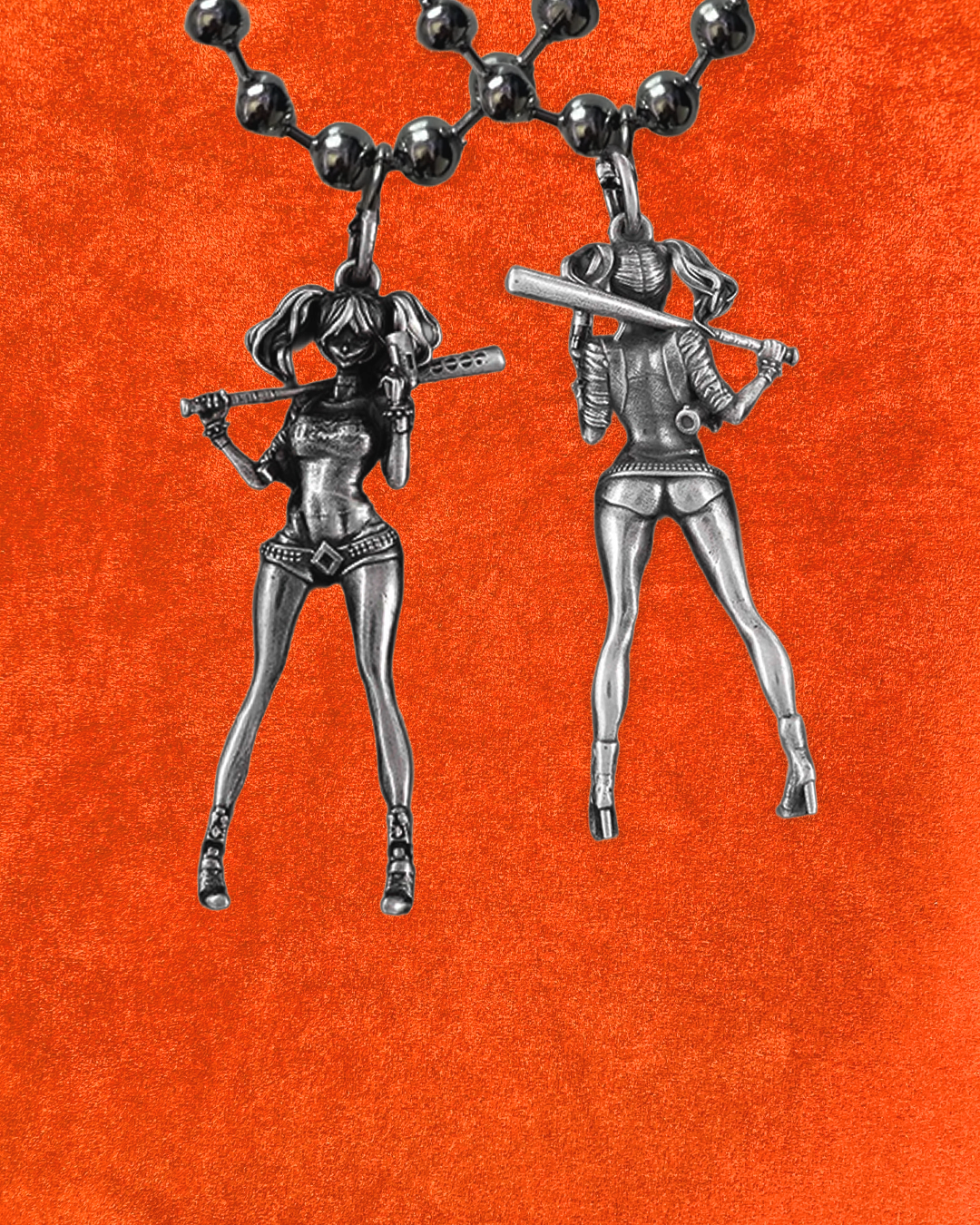Silver Harley Quinn chains on an orange background