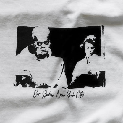 White t-shirt with black graphic design of a man and woman, featuring 'Evo Studios New York City' text.