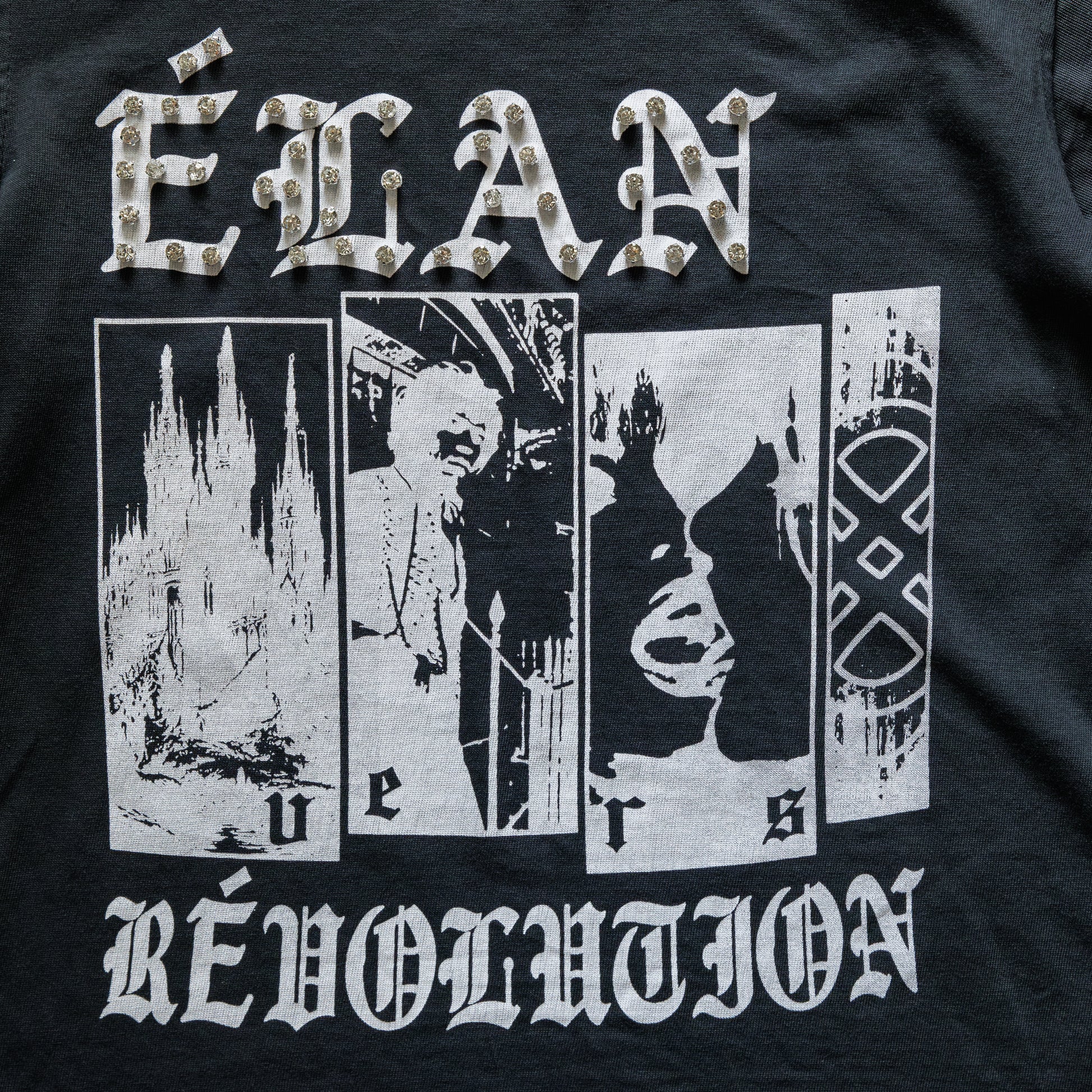 Black t-shirt with white graphic design and text on a dark background