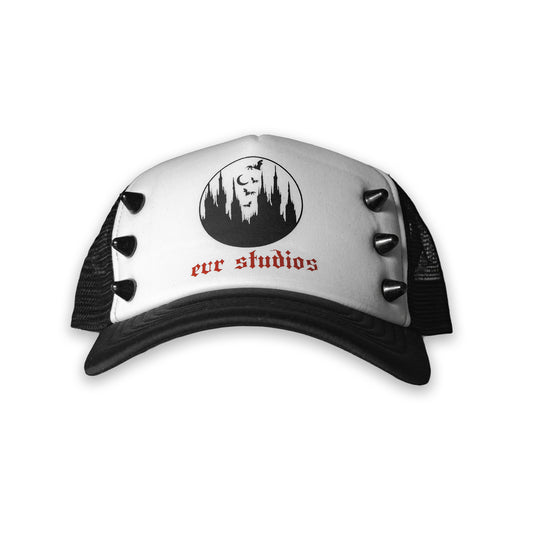 White cap with spikes, black visor and logo on a white background