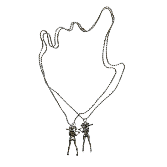 Necklace with two interlocking figures on a white background