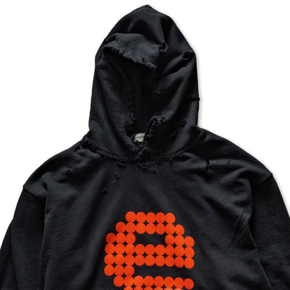 Black hoodie with orange graphic and text on a white background