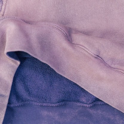 Close-up of a purple fabric with a textured surface