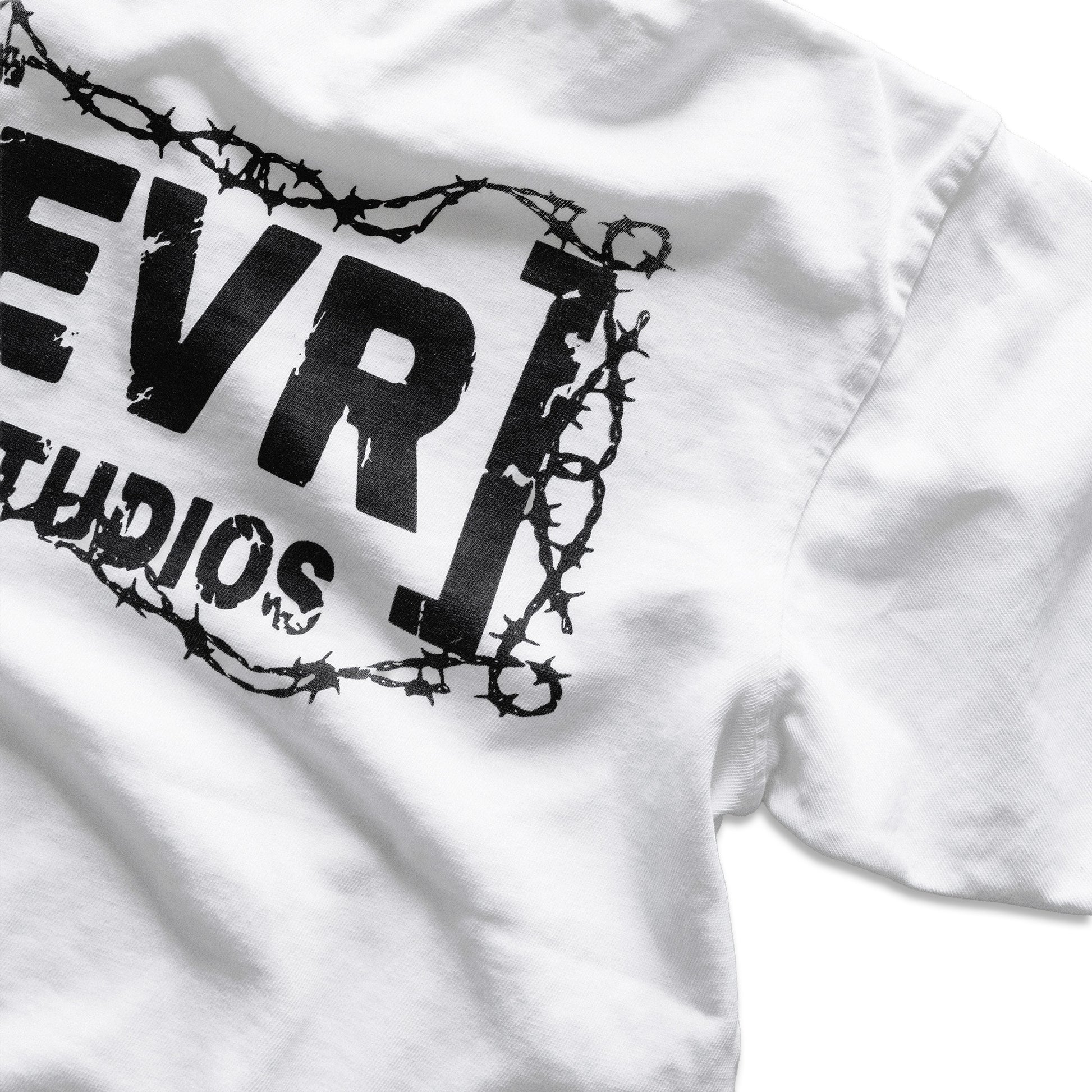 White shirt with black barbed wire design and 'EVR Studios' text on a white background